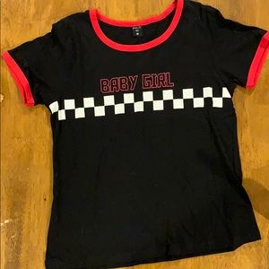 A black, red, and checkered short sleeve shirt.